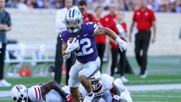 Sep 3, 2022; Manhattan, Kansas, USA; Kansas State Wildcats running back Deuce Vaughn (22) runs the ball for a touchdown against the South Dakota Coyotes in the first quarter at Bill Snyder Family Football Stadium. Mandatory Credit: Scott Sewell-USA TODAY Sports